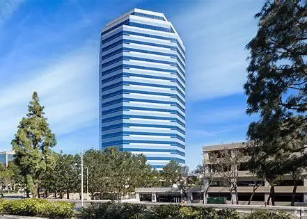 A tall building with trees in front of it